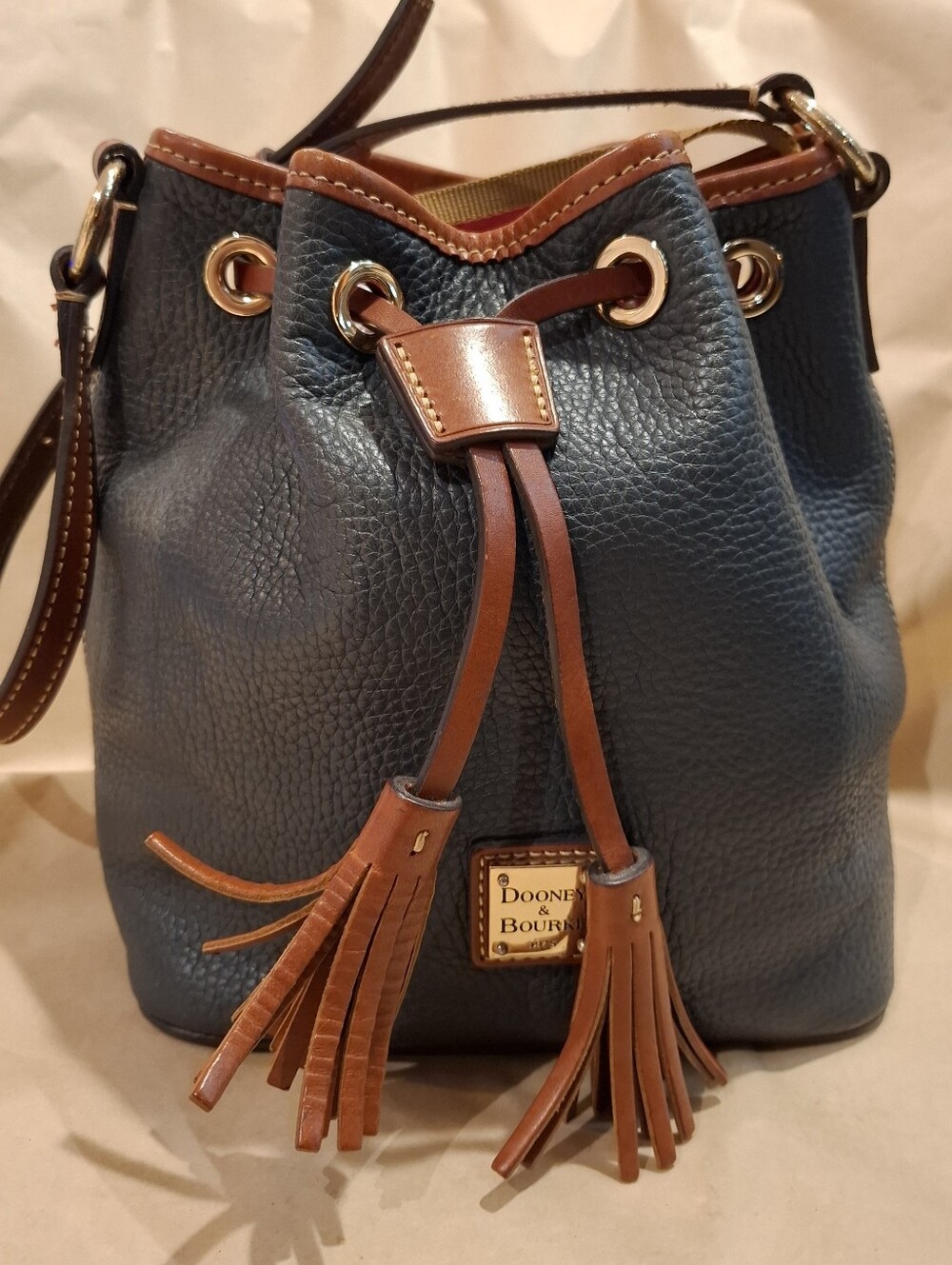 Dooney & Bourke Navy Pebbled Leather Drawstring Bucket Bag with Tan Trim